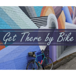 get there by bike text over bike leaning against wall