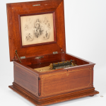 This photo shows an antique music box. 
