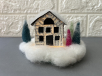 Paper house on felted snow base with three felted pine trees