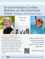 The author and her friend pose on either side of the book.