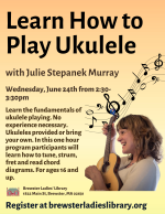 Julie plays the ukulele and smiles.