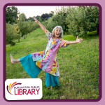 Storyteller Rona Leventhal is photographed in an apple orchard wearing a colorful and floral pattern
