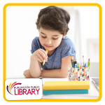 a child works on a drawing at a table
