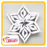 a white, 6-pointed, paper, 3D snowflake made by alternate folding and taping together