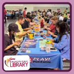 teens and adults match up for Pokemon card tournament, with decks of cards in front of them