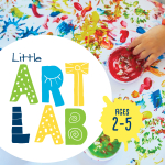 A child's hand reaches into a pot of finger paint on a colorful painted surface.