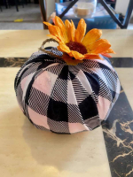 Foam pumpkin covered in buffalo check fabric with sunflower