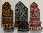 Three pairs of knitted Latvian mittens.