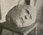 carved stone of a man's head