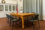 A wooden conference table in the Eloranta Room.