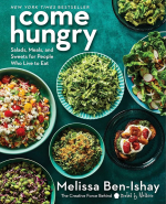 book cover of "Come Hungry" with a deep teal background and several veggie based dishes in ceramic s