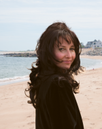 Briana Cash standing on a beach