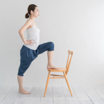 Woman doing yoga on a chair