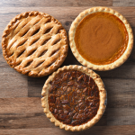 Three pies on a wooden table