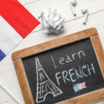 Small chalkboard with "Learn French" and the French flag