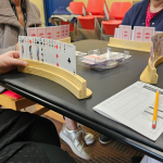 Playing cards for canasta set up on a table