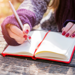 Woman writing in a notebook