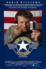 Movie cover of Good Morning Vietnam with Robin Williams in the center pointing his finger out. 