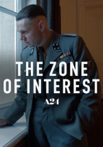A young but high ranking german officer looks out a window
