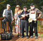 The four members of the Jazzukulele band pose with their instruments.