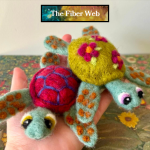 two felted sea turtles