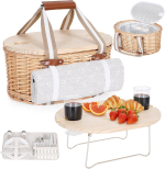 Several different points of view of a wicker picnic basket with a small wooden table, cutlery, plate