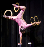 Li Liu balancing on one hand with rings