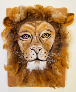 Felt art of a lion's head with mane