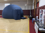 Photo of mobile planetarium--an inflatable dome with a door