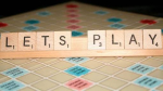 Image of scrabble tiles that spell out Lets Play