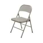 A beige metal folding chair