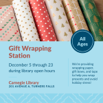 Rolls of colorful, holiday-themed gift wrapping paper placed side by side.