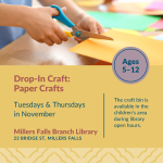 A child's hand using safety scissors to cut construction paper.