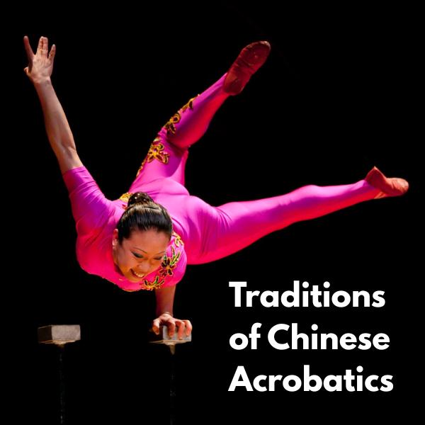 acrobat balancing on one hand.