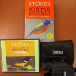 Kit with 2 books and binoculars.