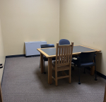Reference study room with a table and four chairs.