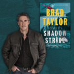 brad taylor standing next to book by brad taylor.