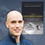 alex next to book cover.