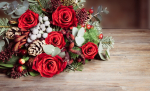 A holiday flower arrangement on a table.
