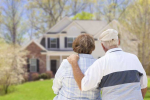 older couple looking at a house