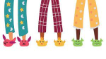 Childrens legs in pajamas and slippers.