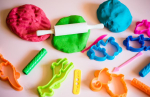 Colorful playdough and tools.