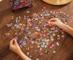 Person putting together a puzzle