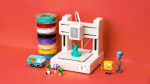 3D printer with small toys made by the pritner.