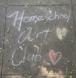 homeschool art club written in sidewalk chalk