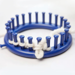 Knitting loom with yarn