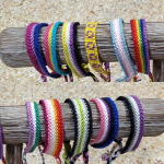 Various friendship bracelets in pride colors