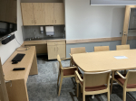 Conference room with sink in background.