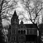 a black and white image of an old house.