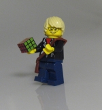Lego person holds a Rubik's cube